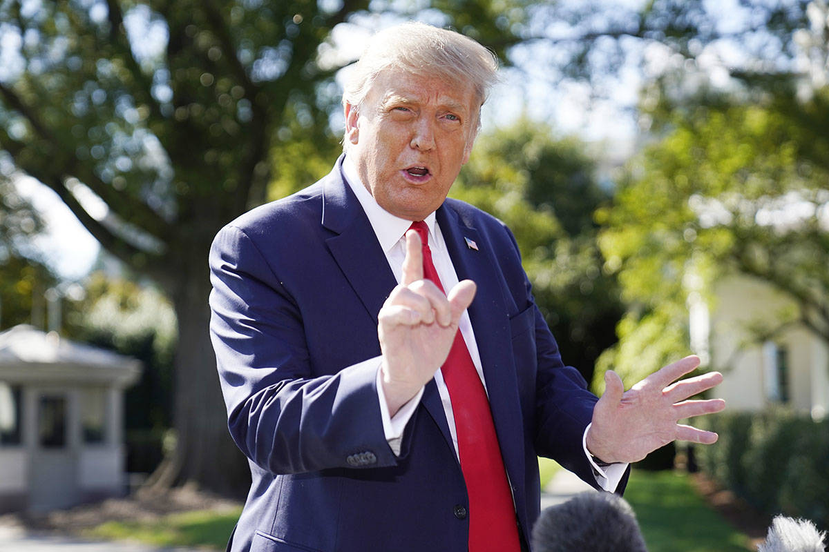 President Donald Trump speaks to the media before boarding Marine One at the White House, Wedne ...