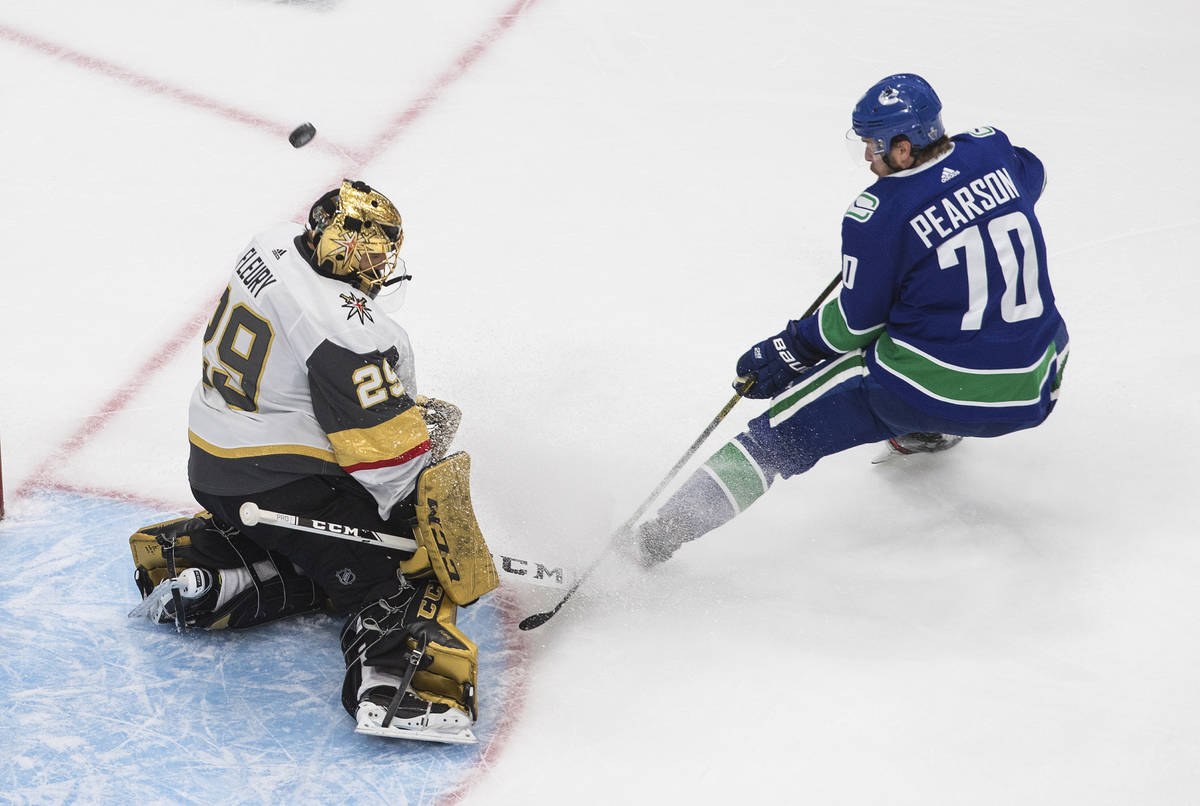 Vegas Golden Knights goalie Marc-Andre Fleury (29) makes a save on Vancouver Canucks' Tanner Pe ...