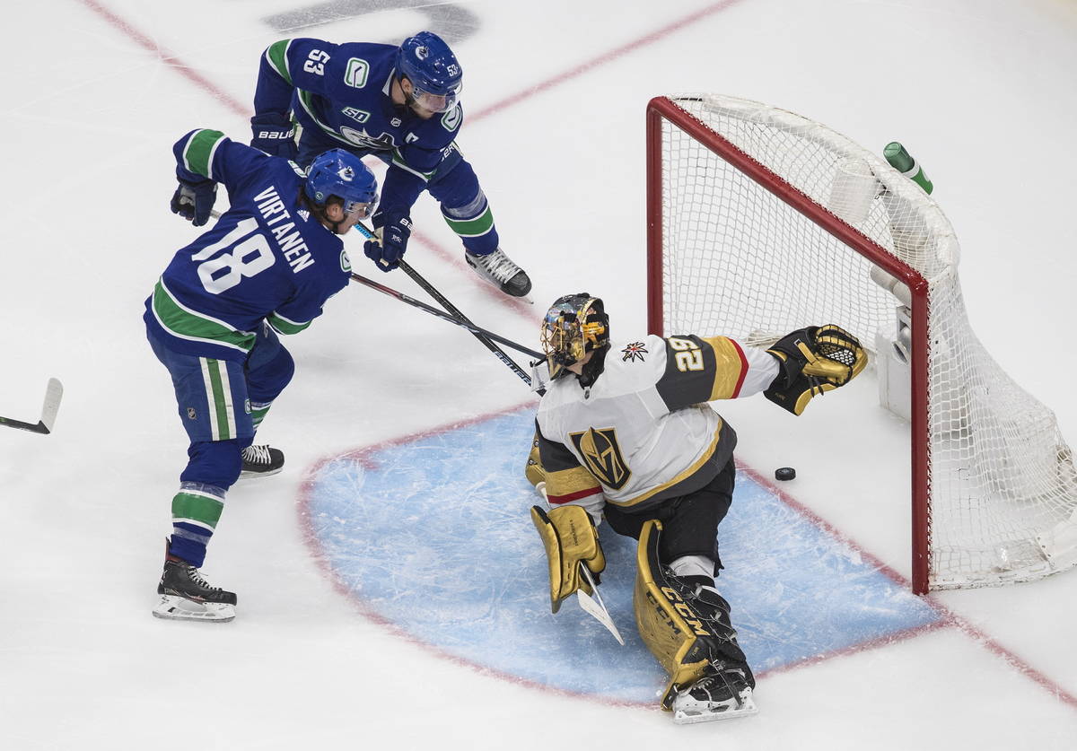 Vegas Golden Knights goalie Marc-Andre Fleury (29) is scored on by Vancouver Canucks' Bo Horvat ...