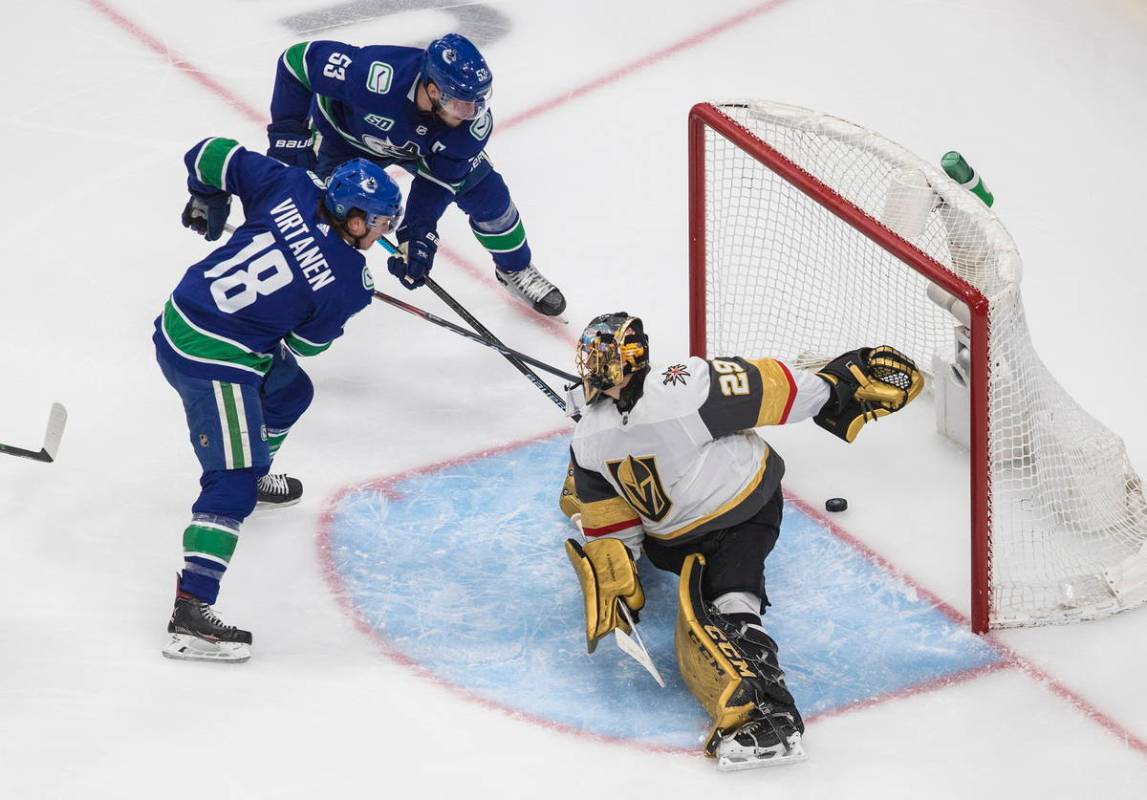 Vegas Golden Knights goalie Marc-Andre Fleury (29) is scored on by Vancouver Canucks' Bo Horvat ...