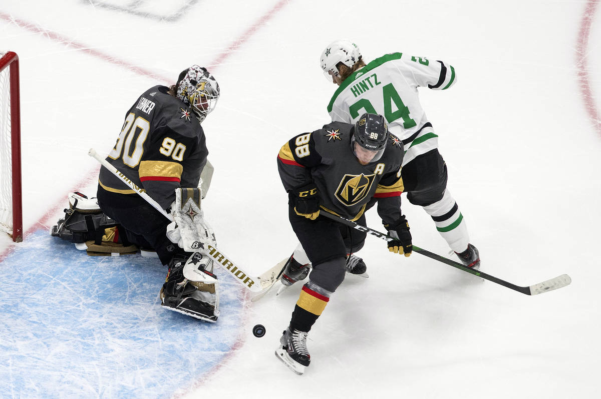 Dallas Stars' Roope Hintz (24) is stopped by Vegas Golden Knights' goalie Robin Lehner (90) as ...