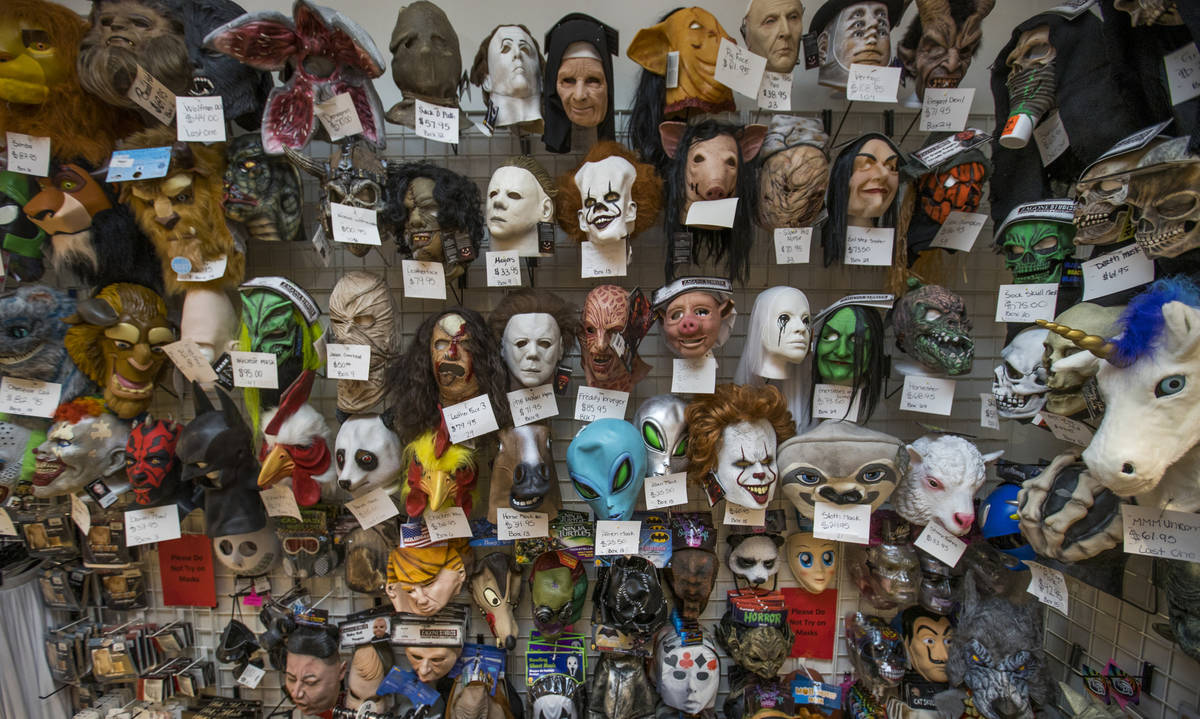 A variety of full-face masks are for sale at the Star Costume & Theatrical Supply on Saturday, ...