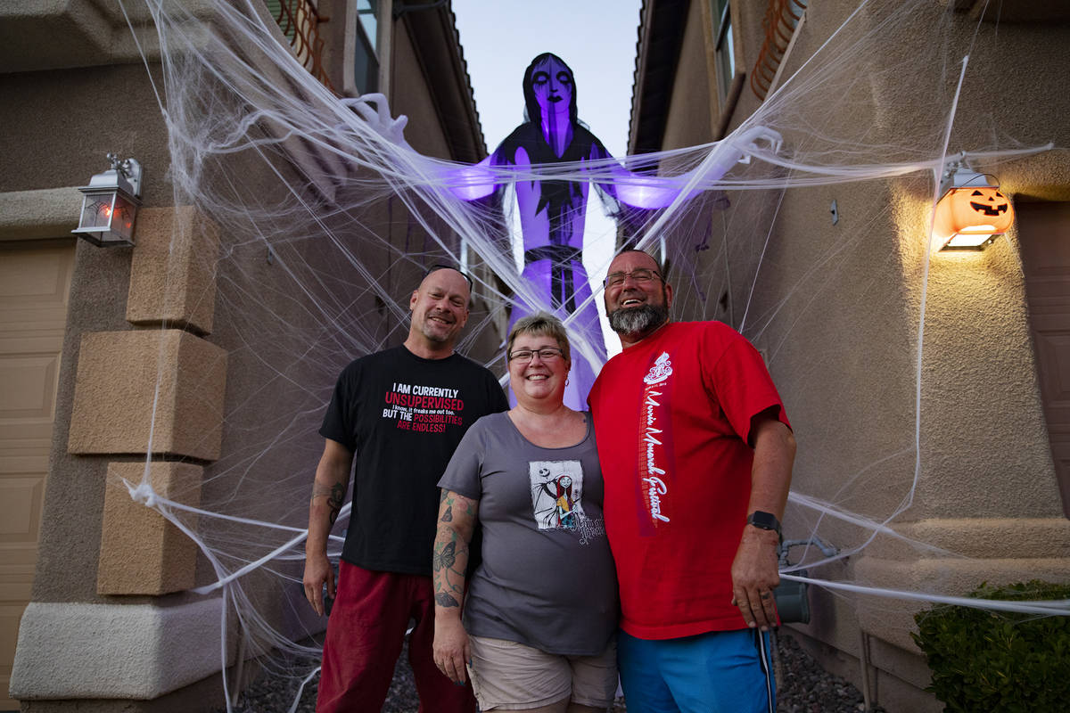 Jeff Conter, from left, neighbor to Deedee Fronius, center, and her husband, Tony Fronius, at t ...