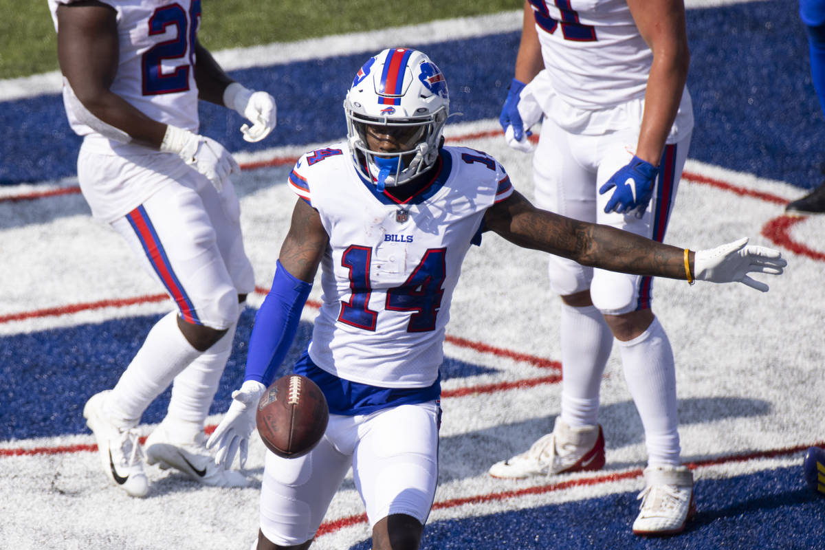 Buffalo Bills wide receiver Stefon Diggs (14) punts the ball in celebration after scoring a tou ...