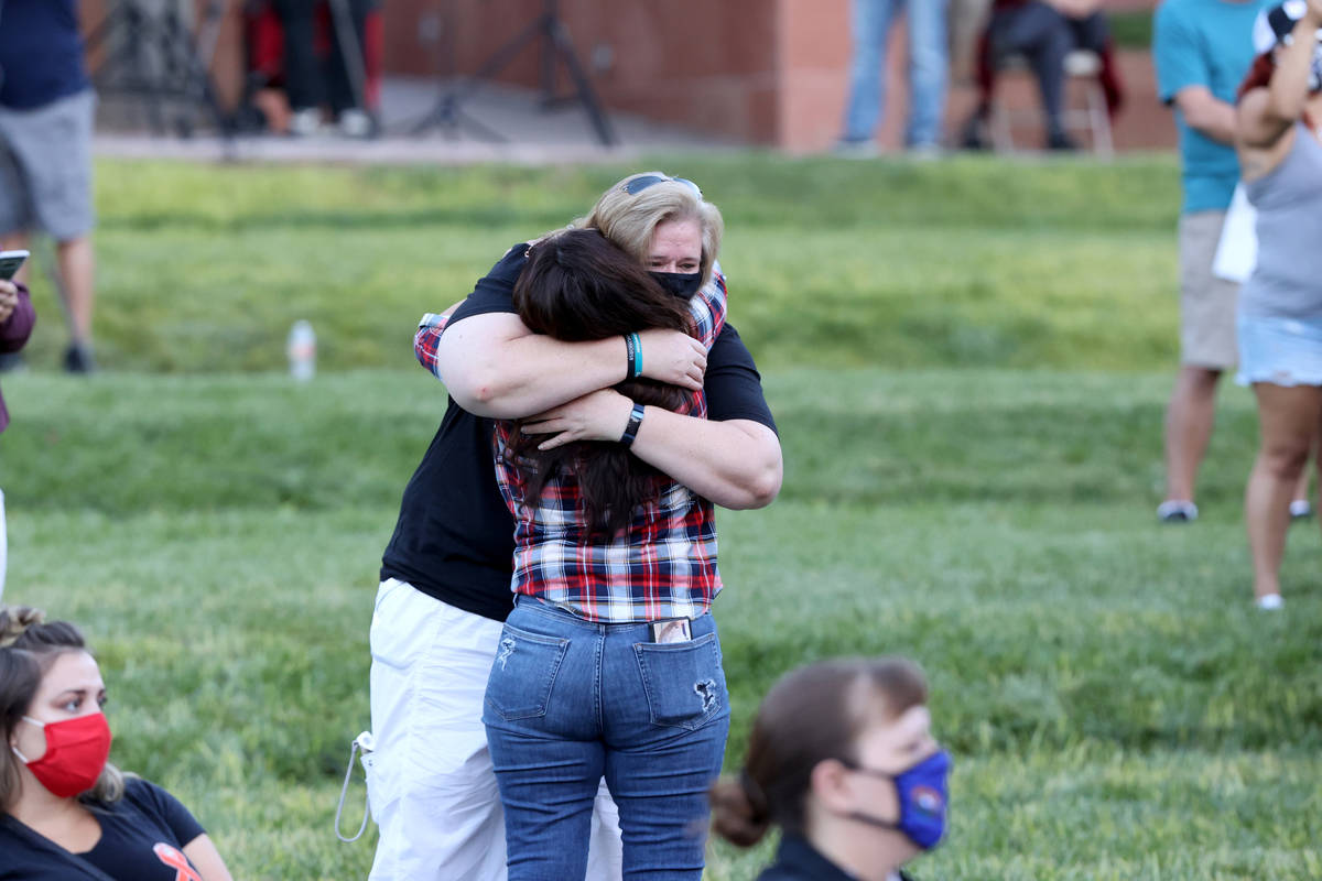Survivors of the Route 91 Harvest festival shooting Terri Davis of Las Vegas, facing, hugs Debb ...