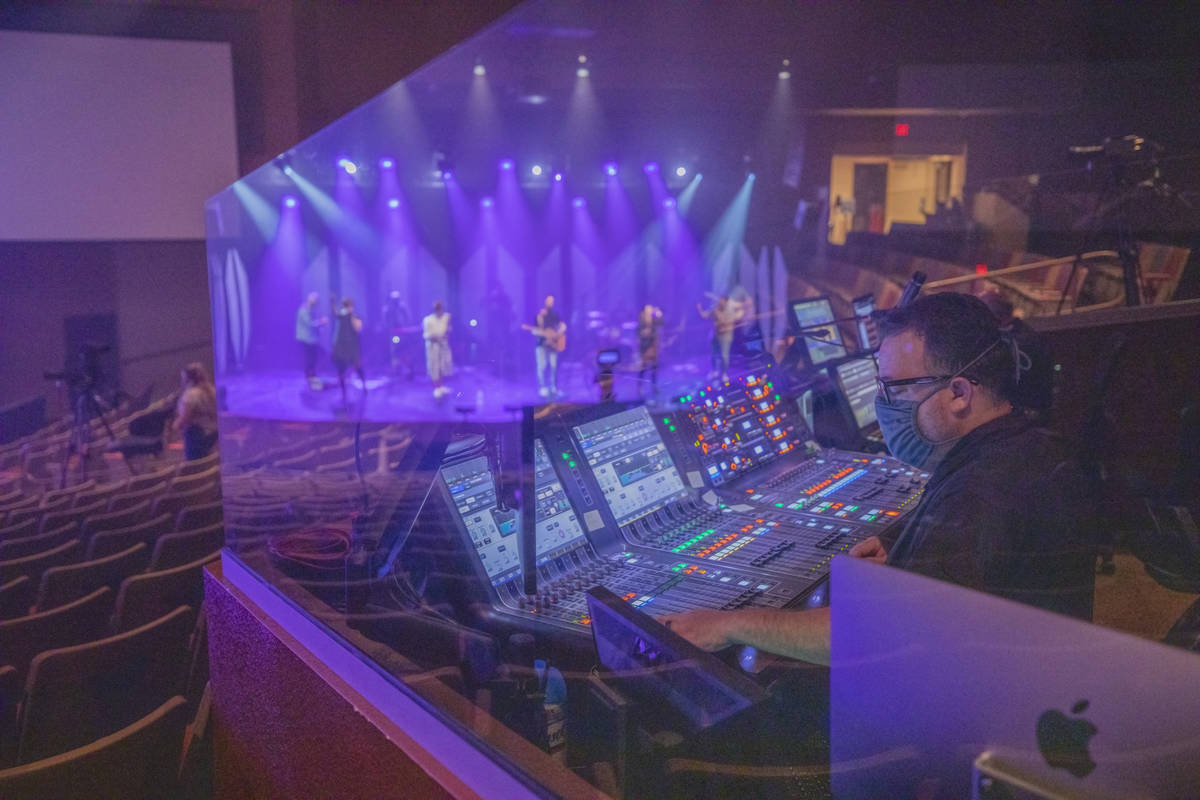 Production director Billy Baker oversees as Canyon Ridge Christian Church's worship team practi ...