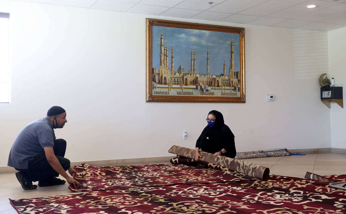 Shamsuddin Waheed, imam at Masjid Ibrahim in Las Vegas, right, and congregant Nancy Burciaga pl ...