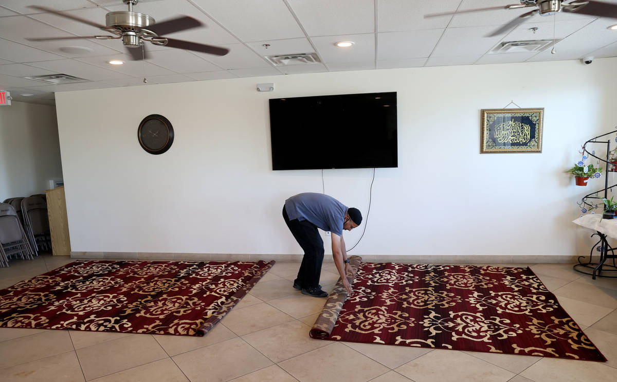 Shamsuddin Waheed, imam at Masjid Ibrahim in Las Vegas, places carpet in his social hall Thursd ...