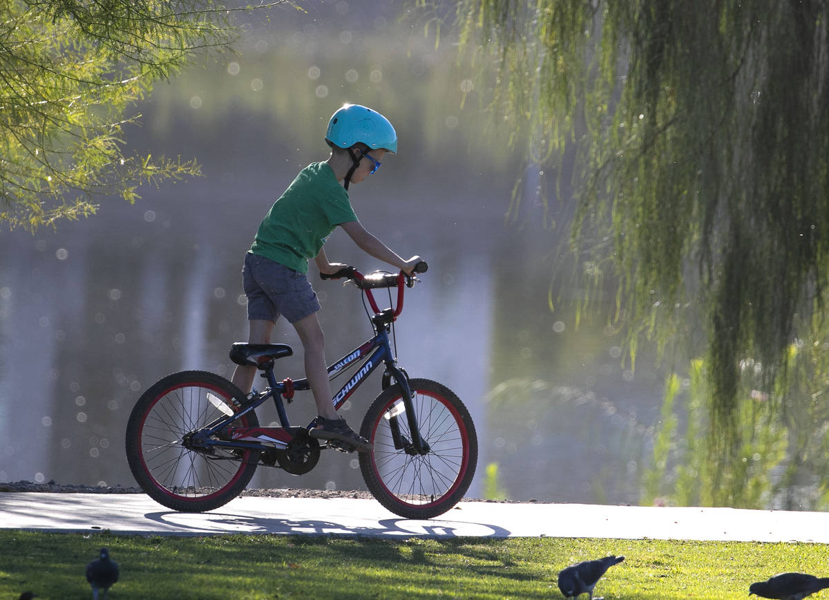 Riley Lowe, 7, rides his bike on a sunny morning at Cornerstone Park on Thursday, Oct. 1, 2020, ...