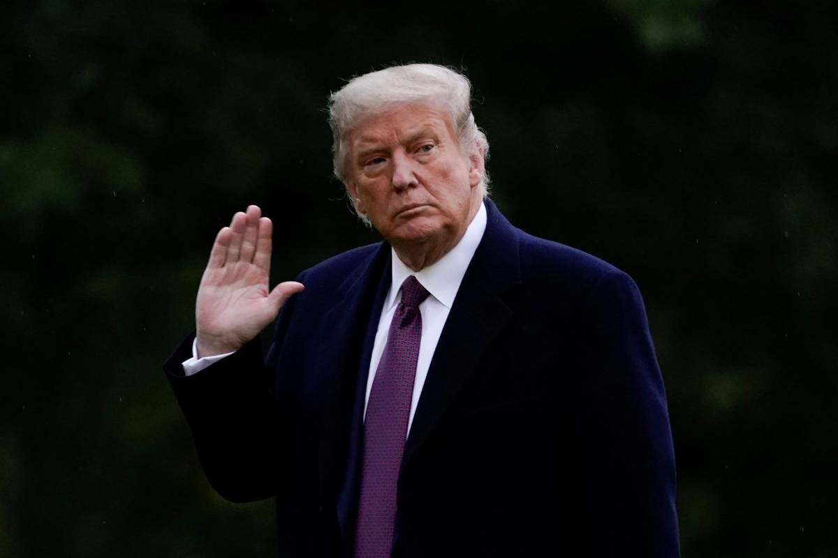 President Donald Trump walks from Marine One to the White House in Washington, Thursday, Oct. 1 ...