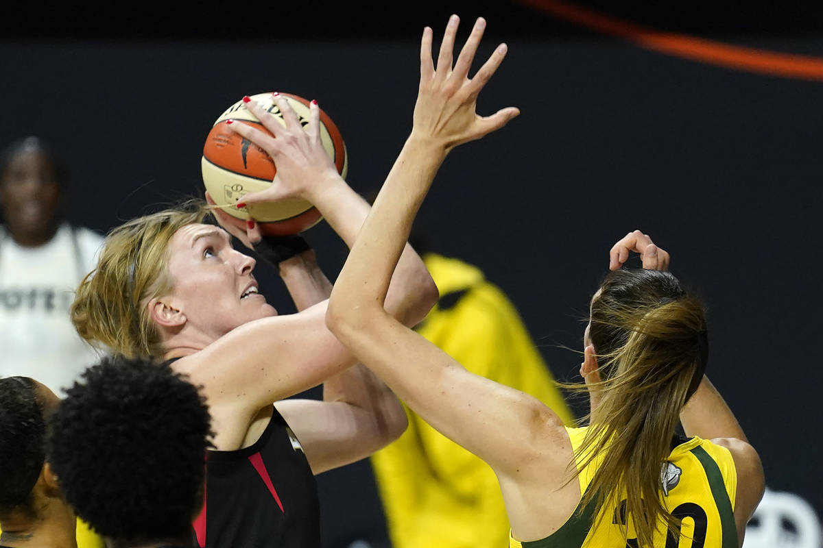 Las Vegas Aces center Carolyn Swords (4) shoots over Seattle Storm forward Breanna Stewart (30) ...