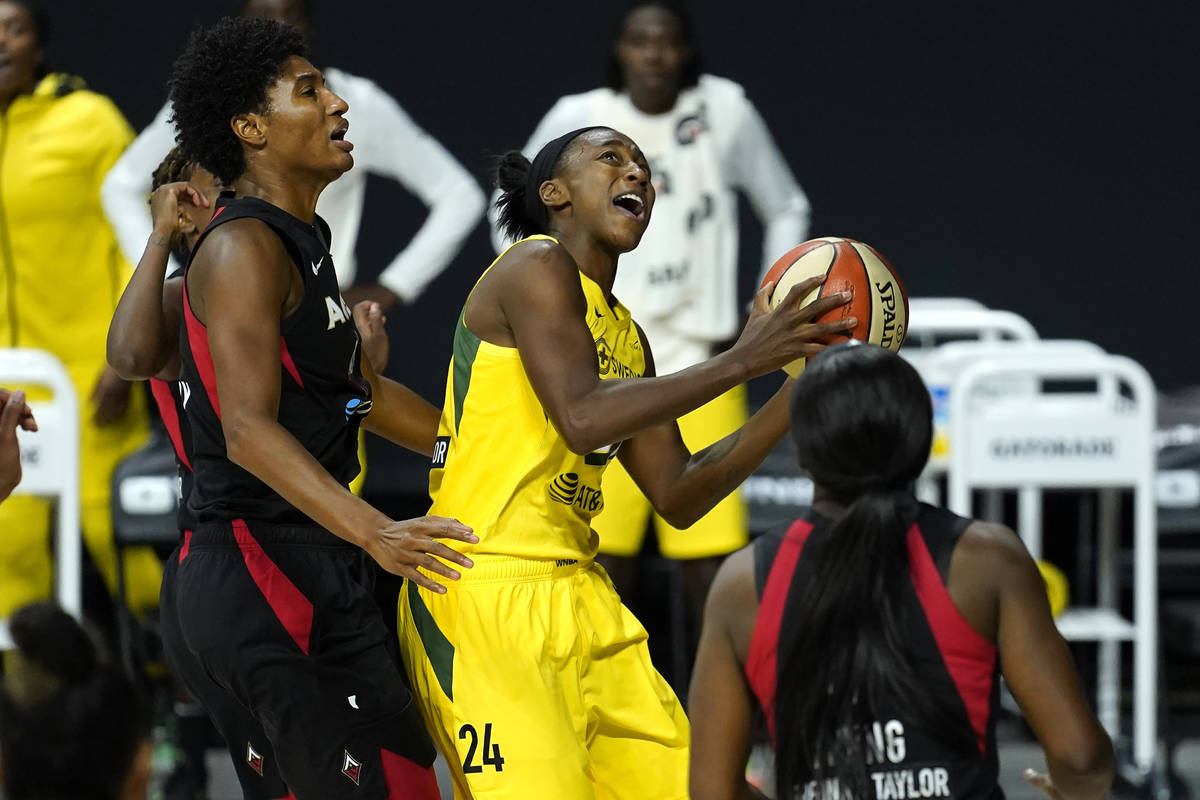 Seattle Storm guard Jewell Loyd (24) goes up to the basket after getting around Las Vegas Aces ...