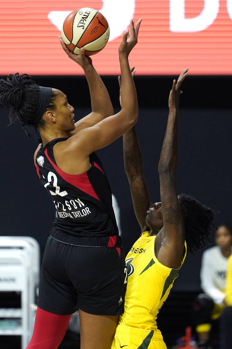 Las Vegas Aces center A'ja Wilson (22) shoots over Seattle Storm forward Natasha Howard (6) dur ...