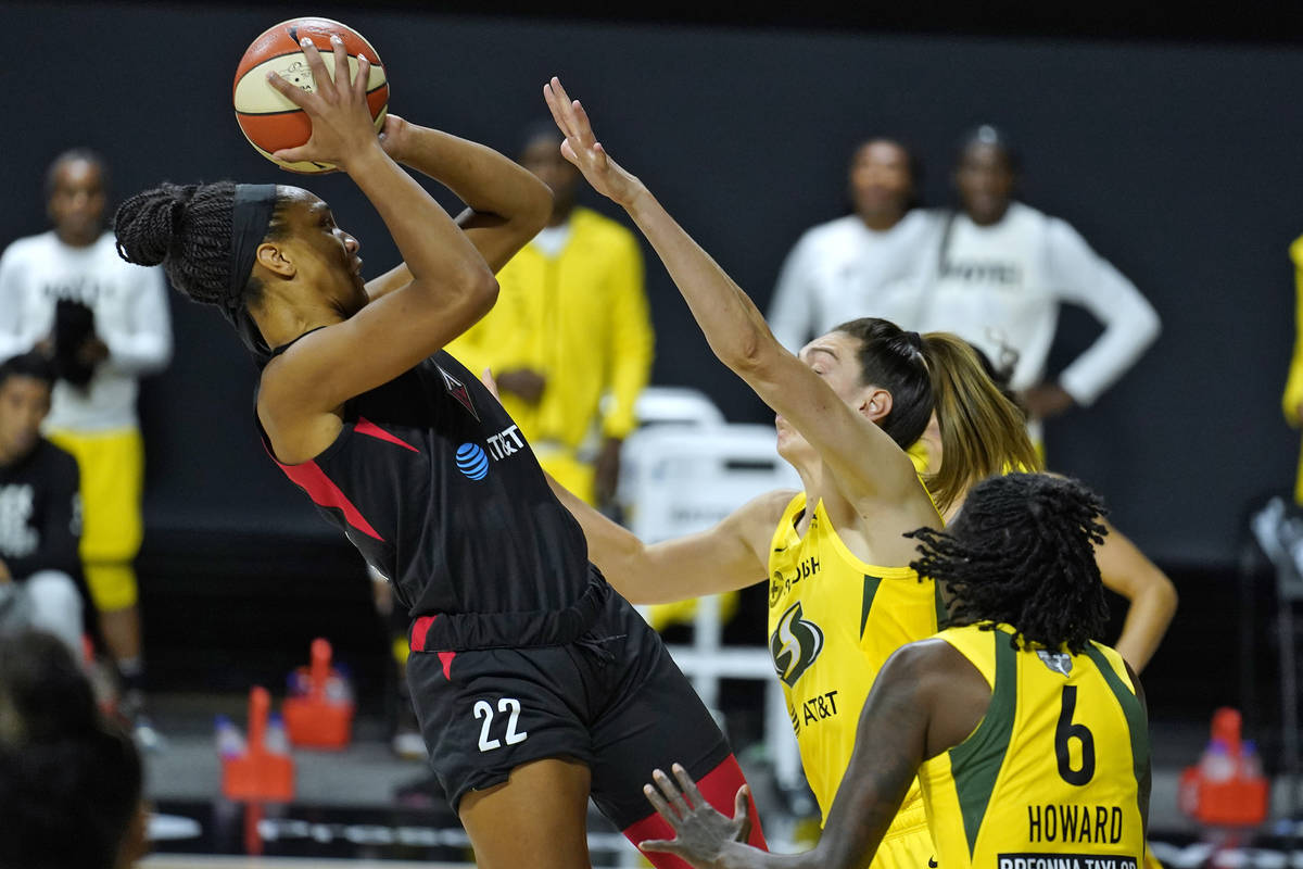 Las Vegas Aces center A'ja Wilson (22) shoots over Seattle Storm forward Breanna Stewart (30) a ...