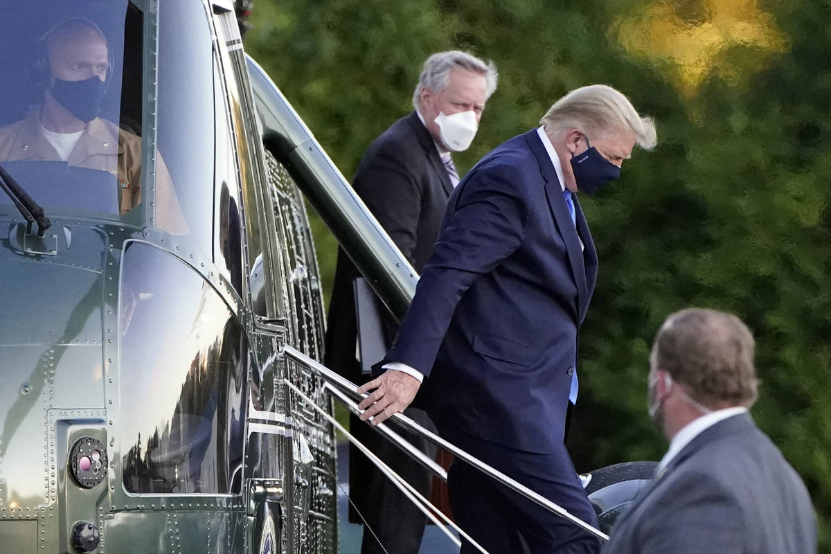 President Donald Trump arrives at Walter Reed National Military Medical Center, in Bethesda, Md ...