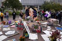 In a Wednesday, Sept. 23, 2020, file photo, people gather in Jefferson Square in Louisville, aw ...