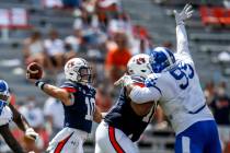 Auburn quarterback Bo Nix (10) throws a pass during the third quarter of an NCAA college footba ...