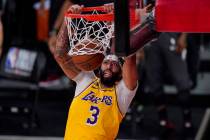 Los Angeles Lakers' Anthony Davis (3) slams a dunk against the Miami Heat during the second hal ...