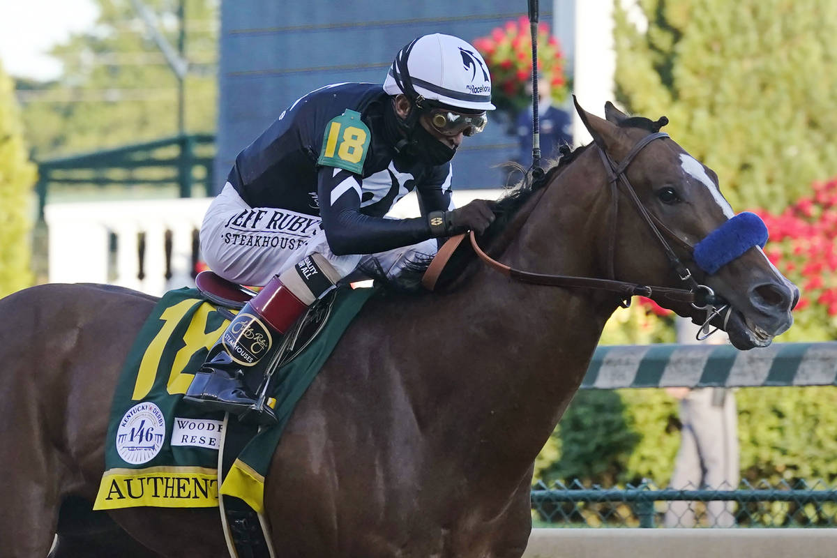 In this Saturday, Sept. 5, 2020, file photo, Authentic, ridden by jockey John Velazquez, heads ...