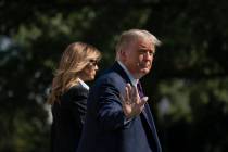 President Donald Trump and first lady Melania Trump walk to board Marine One at the White House ...