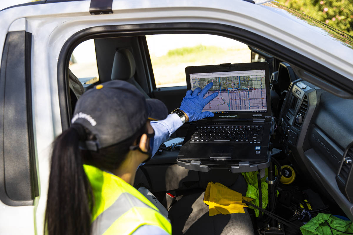 Letty Valenzuela, field technician at Las Vegas Valley Water District, looks at her laptop whil ...