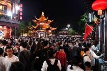 Tourists swarm into the Confucius Temple tourism zone in Nanjing in east China's Jiangsu provin ...
