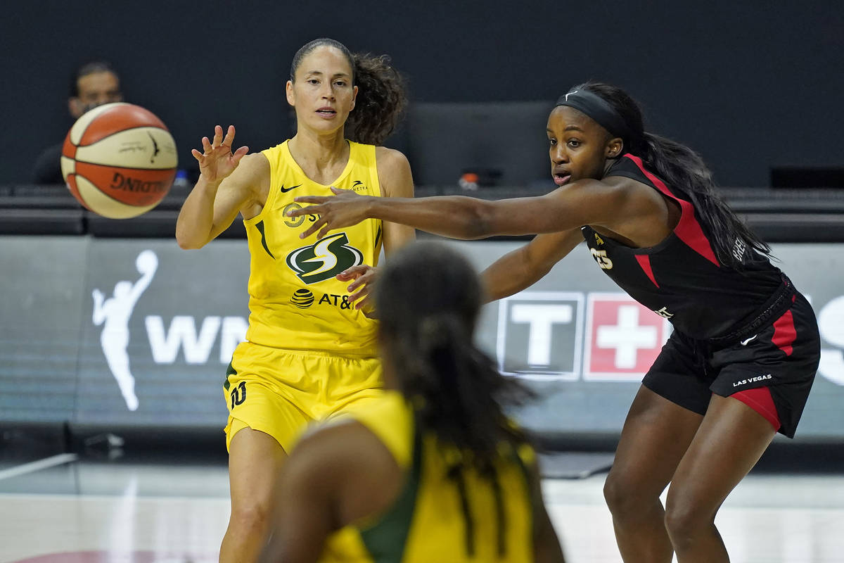 Seattle Storm guard Sue Bird (10) passes the ball to guard Epiphanny Prince (11) as she is guar ...