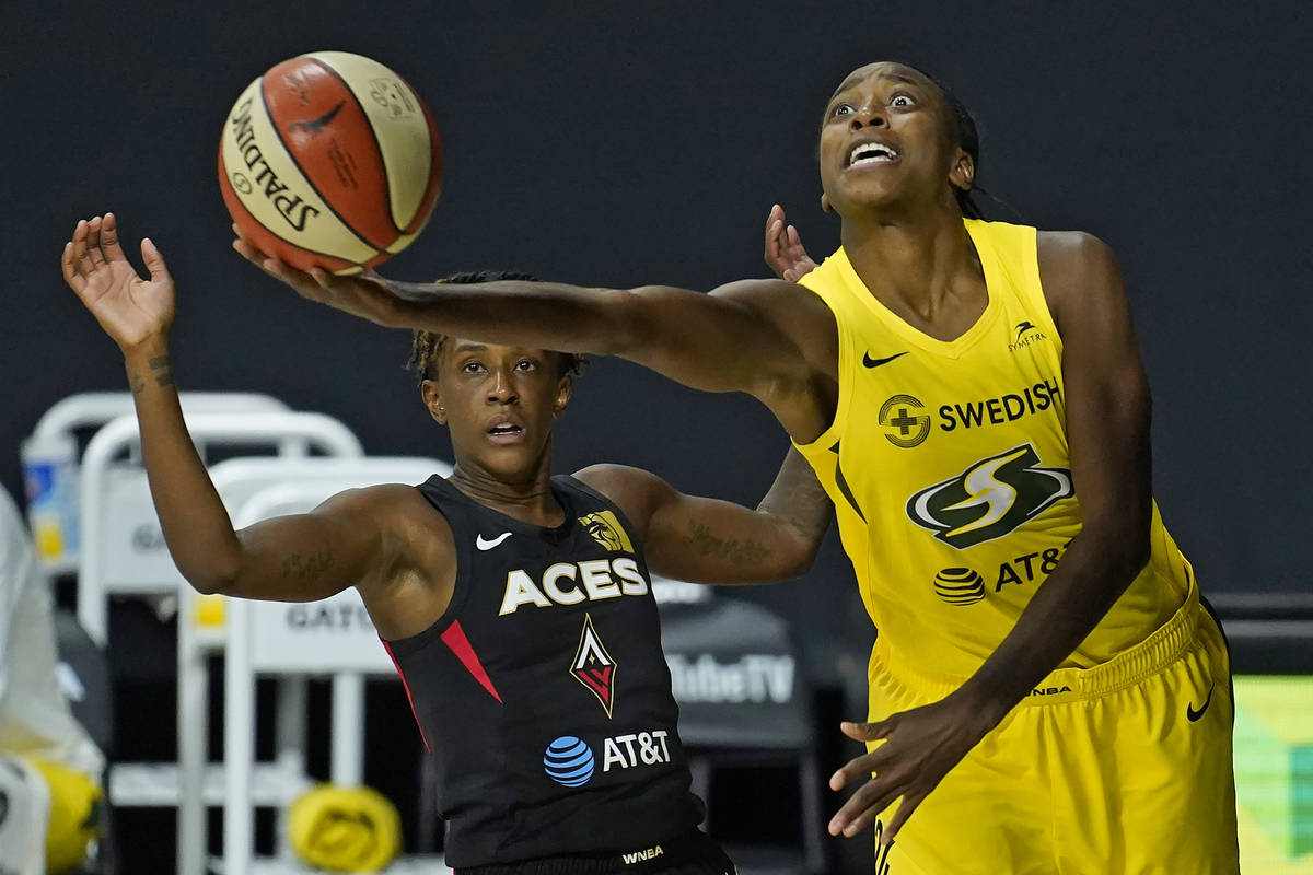 Seattle Storm guard Jewell Loyd (24) goes up for a shot after getting around Las Vegas Aces gua ...