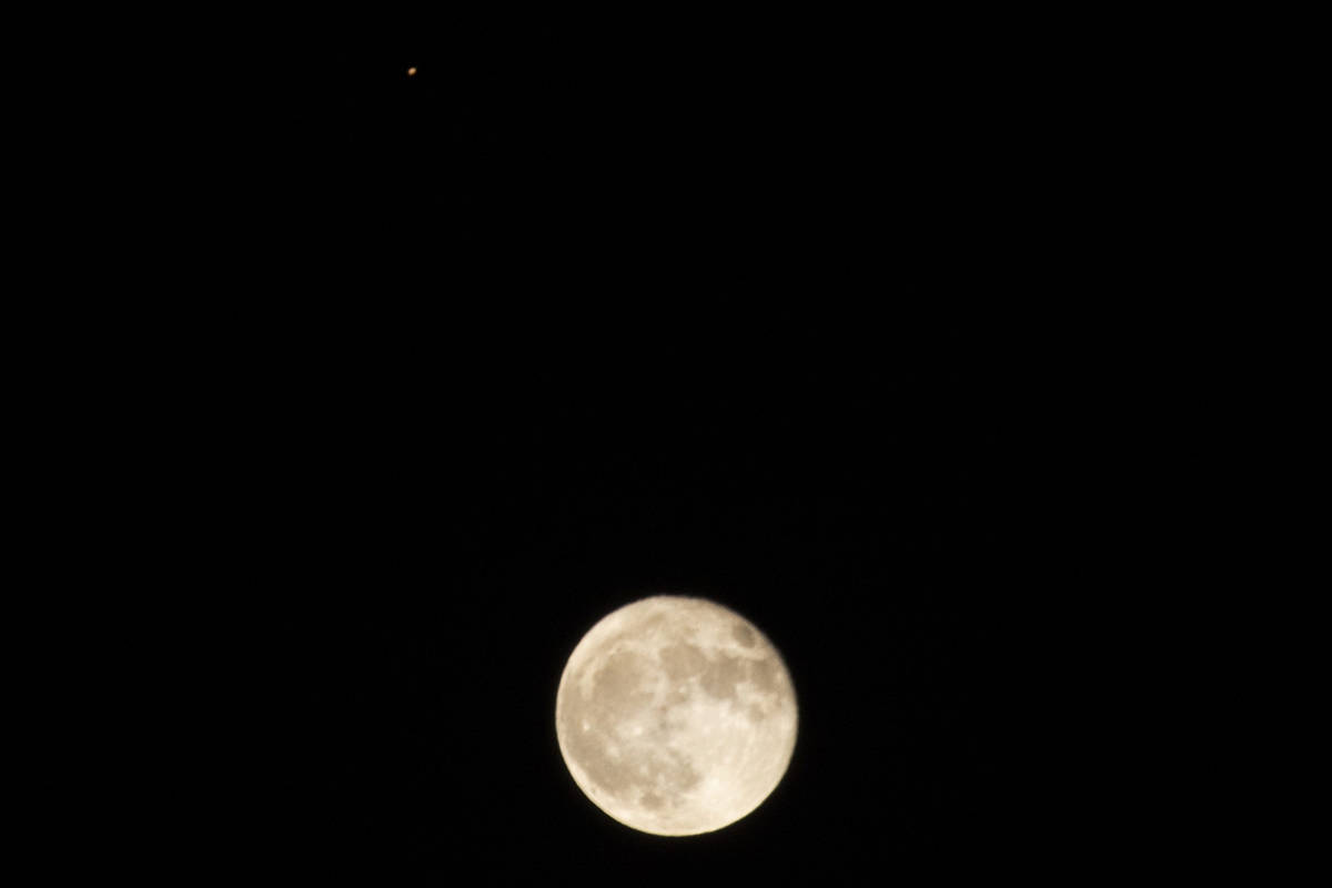 A glimpse of the moon and Mars (at top) seen above the Las Vegas Valley on Friday, Oct. 2, 2020 ...