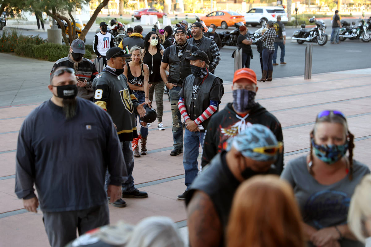 People line up to check-in for the Country Strong Foundation Route 91 Memorial Ride at the Las ...