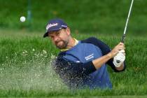 Webb Simpson, of the United States, plays a shot from a bunker on the fifth hole during the fin ...