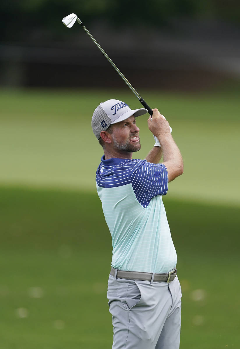 Webb Simpson hits from the third fairway during the first round of the Tour Championship golf t ...