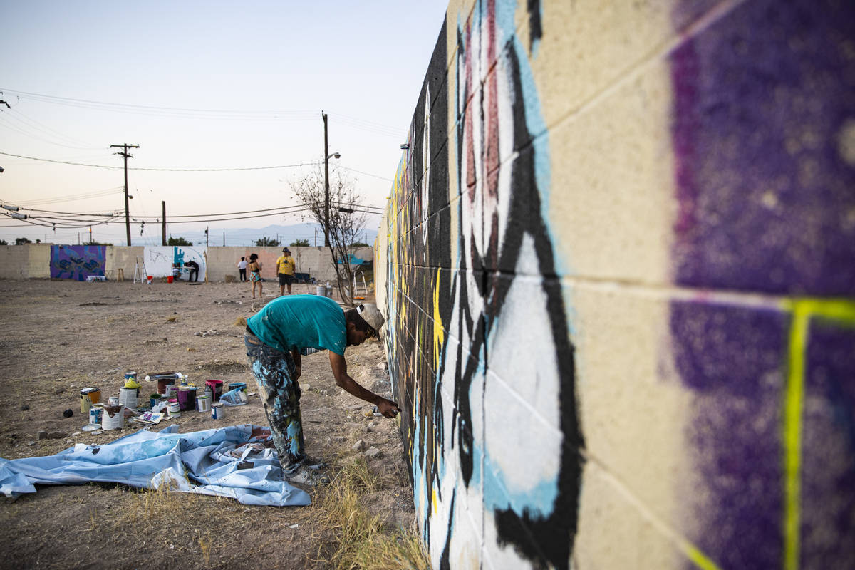 An artist who goes by Five Fs work on a mural at the site of the former Moulin Rouge in Las Veg ...