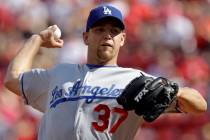 Los Angeles Dodgers pitcher Charlie Haeger throws to a Cincinnati Reds batter during a baseball ...