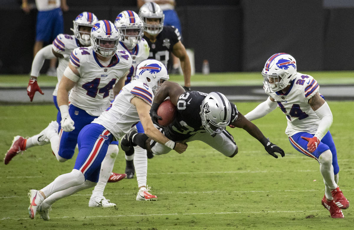 Las Vegas Raiders running back Jalen Richard (30) returns a kick against Buffalo Bills cornerba ...