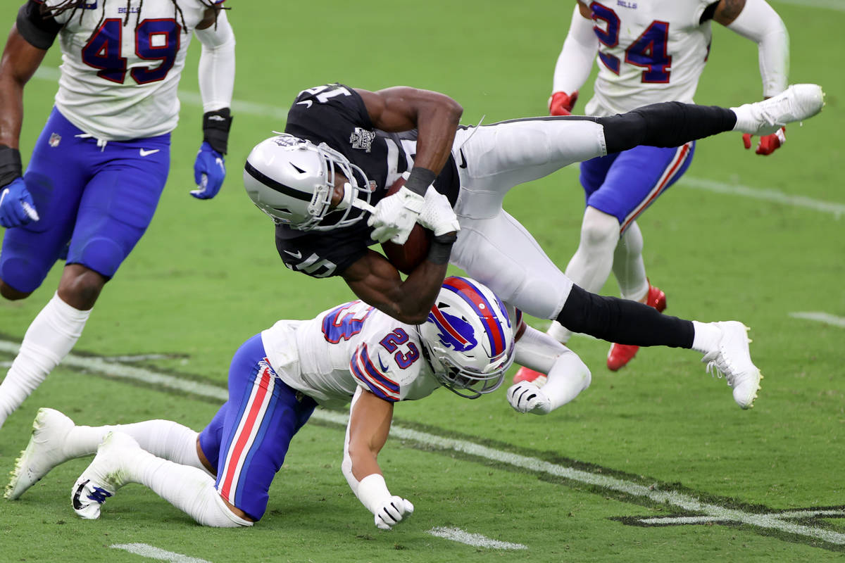 Buffalo Bills strong safety Micah Hyde (23) tackles Las Vegas Raiders wide receiver Nelson Agho ...