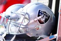 The Oakland Raiders helmets lay in an equipment box on the team's sideline during the first hal ...