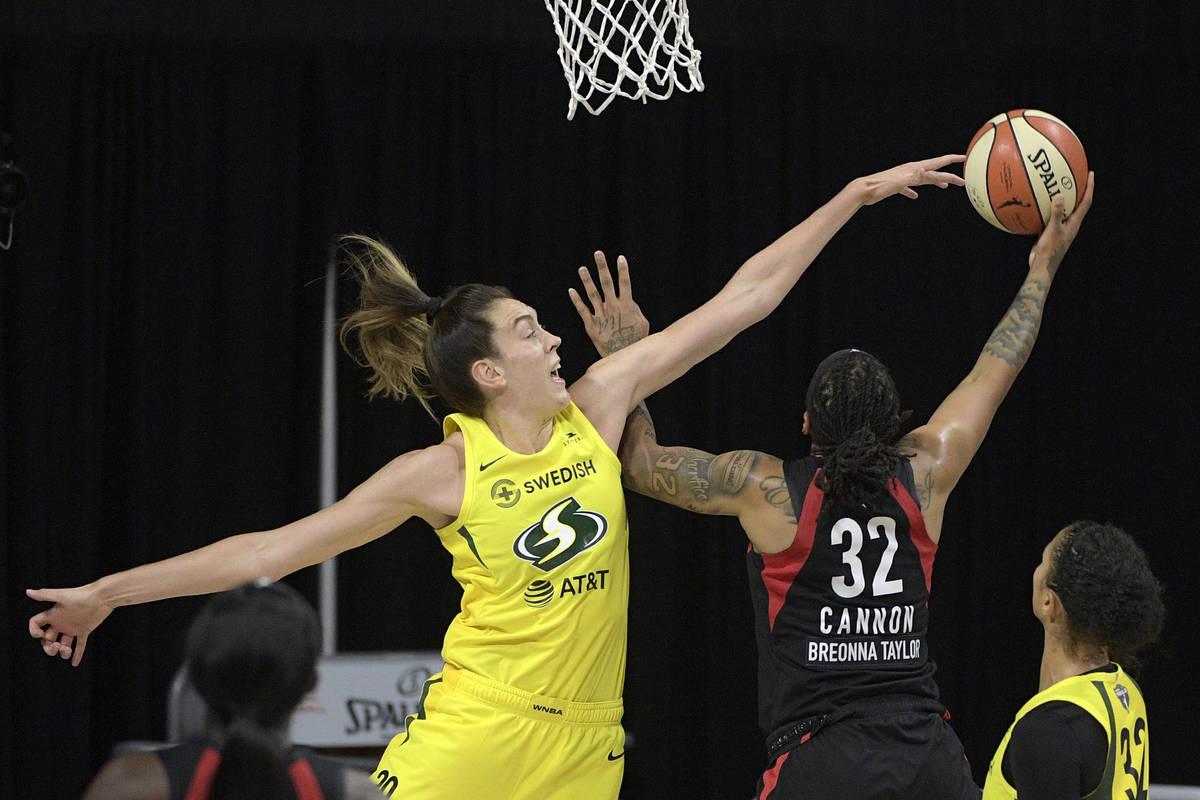 Las Vegas Aces forward Emma Cannon (32) goes up to shoot as Seattle Storm forward Breanna Stewa ...
