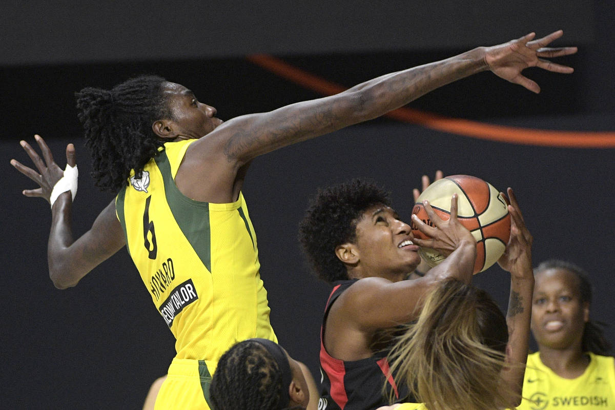 Seattle Storm forward Natasha Howard (6) goes up to block a shot by Las Vegas Aces forward Ange ...