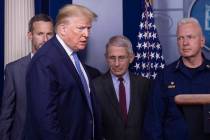 President Donald Trump arrives to speak, with Dr. Anthony Fauci, director of the National Insti ...