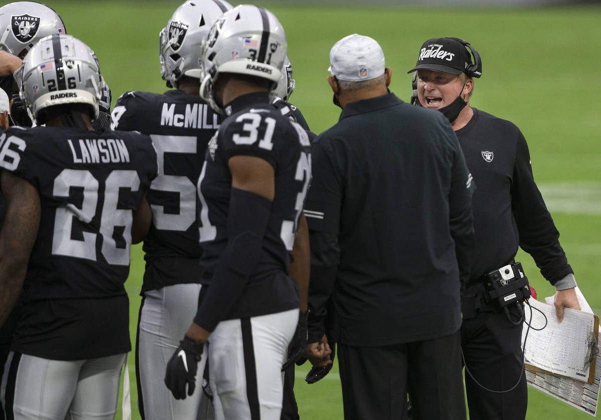 Las Vegas Raiders head coach Jon Gruden speaks to his players on the sideline during the 2nd qu ...