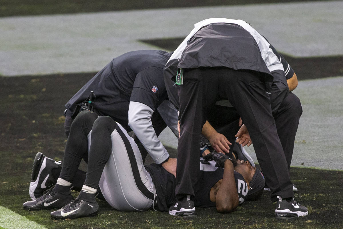 Las Vegas Raiders free safety Lamarcus Joyner (29) remains on the field to be looked at for an ...