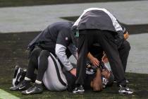 Las Vegas Raiders free safety Lamarcus Joyner (29) remains on the field to be looked at for an ...