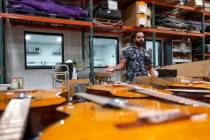 Ryan Patrick, guitarist for Las Vegas band Otherwise, unloads a shipment of guitars at Structur ...