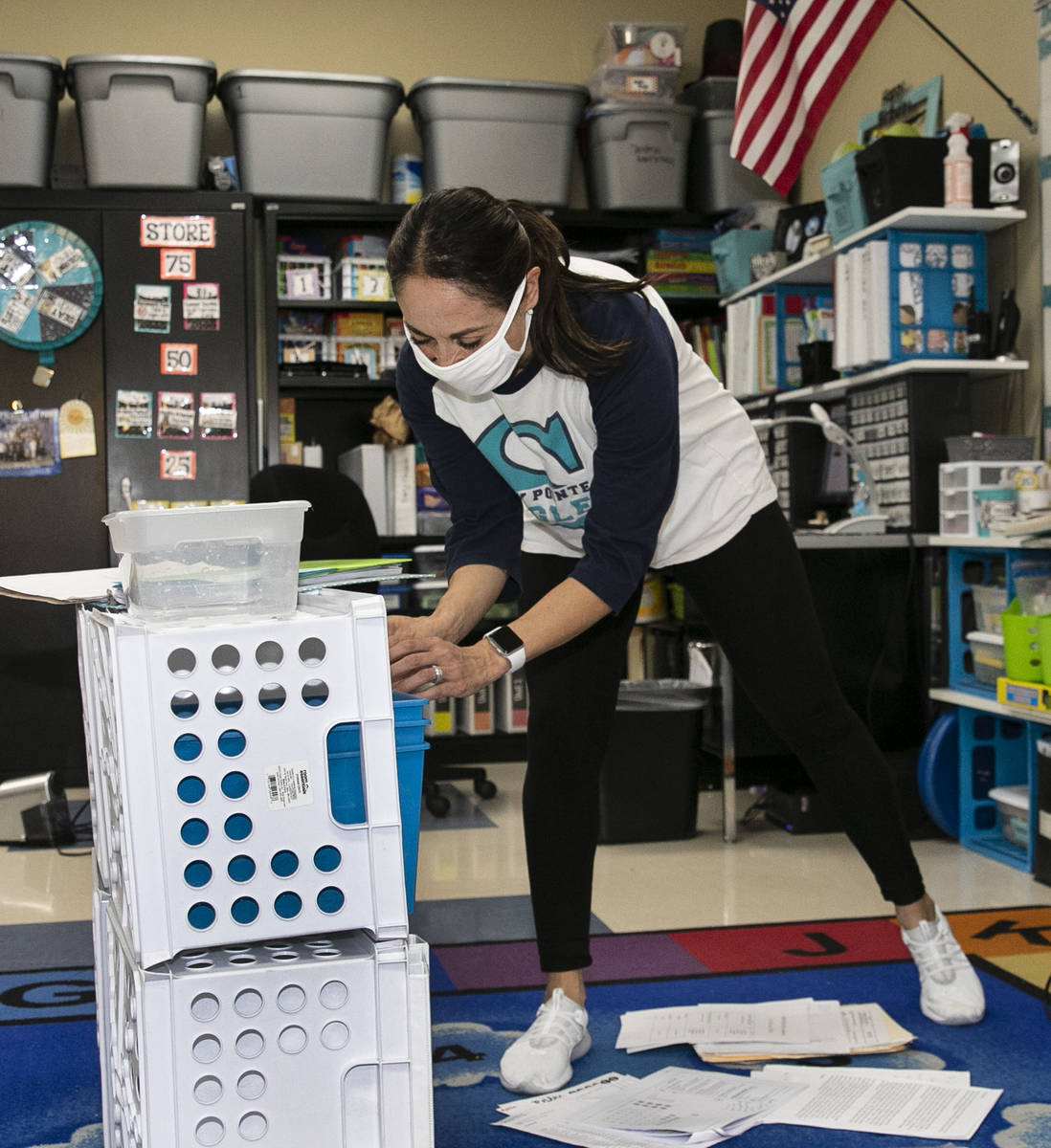Debbie Martin, second grade teacher, sorts out worksheets at Somerset Academy Sky Pointe as she ...