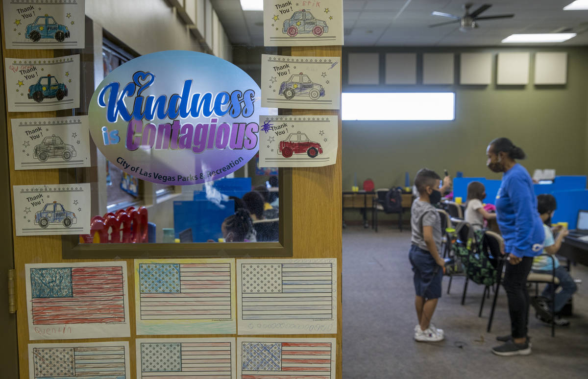 Artwork lines the classroom door for first and second graders in the Vegas Strong Academy at th ...