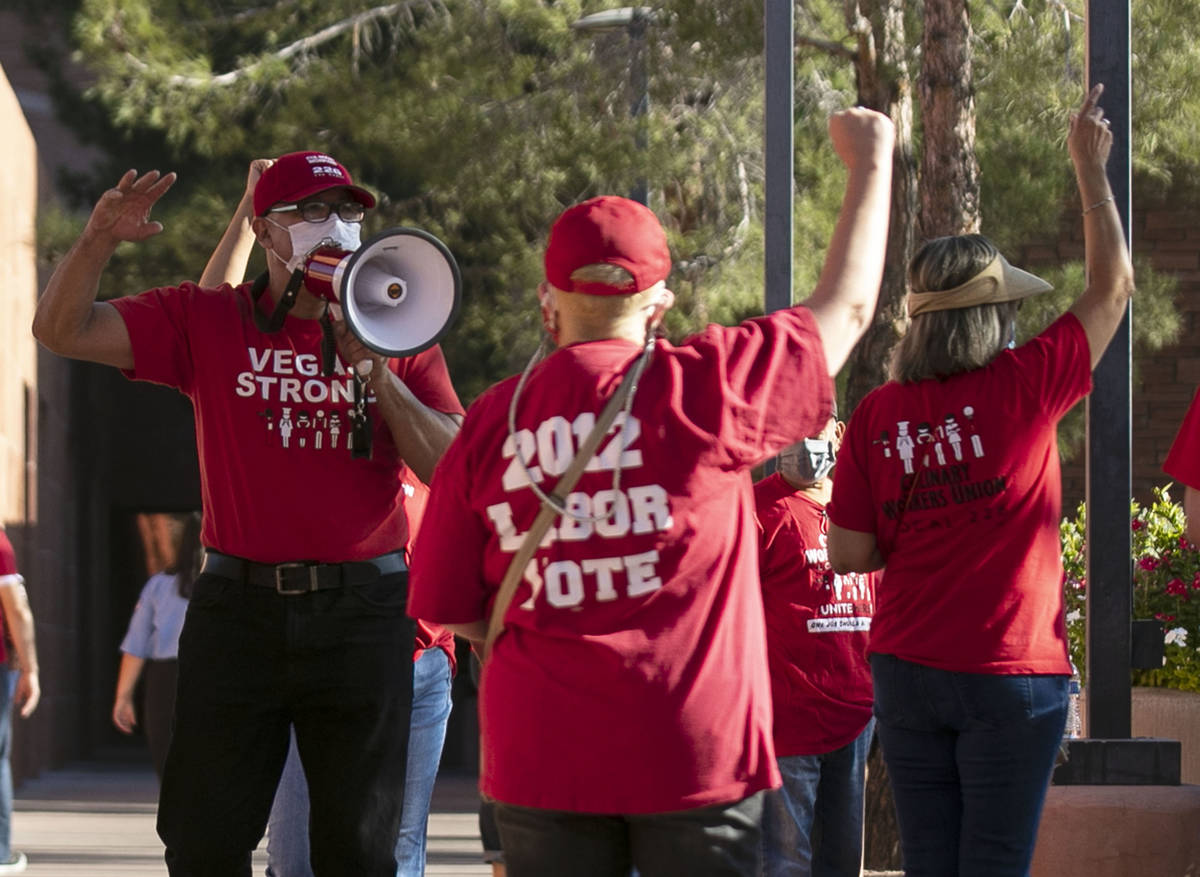 Jose Rivera, left, rally organizer, shouts slogans as he joins a rally outside of the Clark Co ...