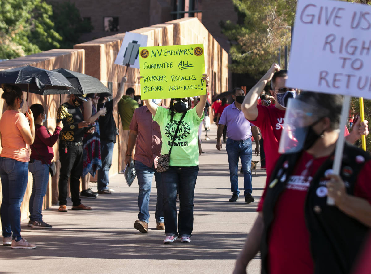 Members of labor unions rally outside of the Clark County Commission Building on Tuesday, Oct. ...