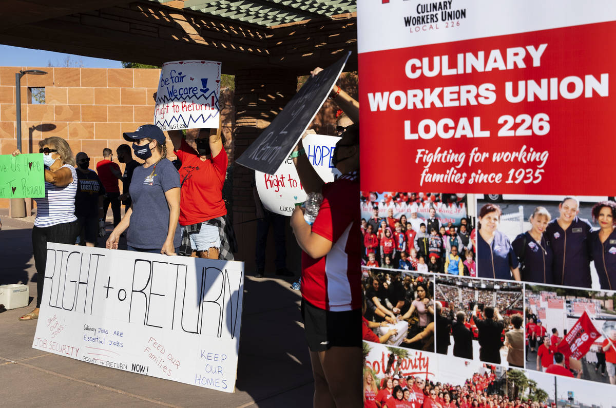 Workers rally outside of the Clark County Commission Building on Tuesday, Oct. 6, 2020, in Las ...