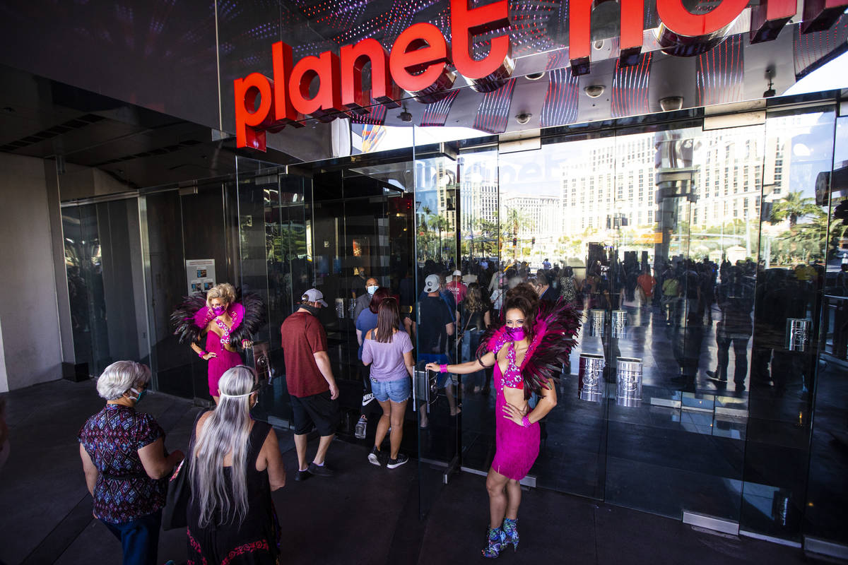Guests head to the casino after the reopening of the Planet Hollywood Resort in Las Vegas on Th ...